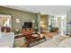 Cozy living room features a decorative fireplace and neutral toned furnishings at 1041 Cherry Valley Way, Orlando, FL 32828