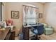 Cozy office area featuring a traditional desk, comfortable chair, and natural light from a window at 1041 Cherry Valley Way, Orlando, FL 32828