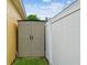 Outdoor storage shed providing practical space for garden tools and equipment beside the house at 1041 Cherry Valley Way, Orlando, FL 32828