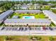 Aerial view of a low rise apartment complex with a central pool and manicured landscaping at 1100 E Caroline St # 204, Tavares, FL 32778