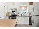 Well-appointed kitchen featuring granite countertops, stainless steel appliances, and modern cabinets for a sleek look at 1100 E Caroline St # 204, Tavares, FL 32778