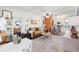 Inviting living room area flowing into a kitchen, featuring comfortable seating and stylish decor for relaxation at 1100 E Caroline St # 204, Tavares, FL 32778