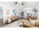 Bright living room featuring a comfortable sofa, stylish furnishings, and a serene ambiance with lots of light at 1100 E Caroline St # 204, Tavares, FL 32778