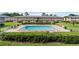 An eye-level view of the community pool and manicured landscaping at 1100 E Caroline St # 204, Tavares, FL 32778