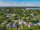 Aerial view of a neighborhood with tree lined streets and community features at 1115 Naples Dr, Orlando, FL 32804