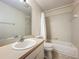 Bright bathroom features a tub with white tile surround, neutral walls and tile floors at 1115 Naples Dr, Orlando, FL 32804
