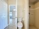 Bathroom includes a toilet and step-in shower with tile surround at 1115 Naples Dr, Orlando, FL 32804