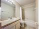 Bathroom with a white vanity, toilet, and shower-tub combination with white tiles at 1115 Naples Dr, Orlando, FL 32804