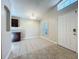 Bright dining room area with tile flooring, a decorative light fixture, and plantation shutters at 1115 Naples Dr, Orlando, FL 32804