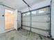Two-car garage showcasing door, opener and access to the home's interior at 1115 Naples Dr, Orlando, FL 32804