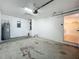 Spacious two-car garage with water heater and lots of potential for storage or workshop space at 1115 Naples Dr, Orlando, FL 32804