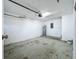 Unfinished garage showing block wall and water heater at 1115 Naples Dr, Orlando, FL 32804