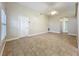 Inviting living room with tile flooring, a ceiling fan, and a doorway to a hallway at 1115 Naples Dr, Orlando, FL 32804