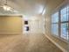 Open living space with tile flooring, plantation shutters, and a glimpse of the updated kitchen at 1115 Naples Dr, Orlando, FL 32804