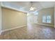 Bright and airy living room with tile flooring, neutral walls, and arched windows providing natural light at 1115 Naples Dr, Orlando, FL 32804