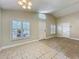 Bright living room featuring large windows with plantation shutters and tile flooring at 1115 Naples Dr, Orlando, FL 32804