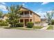 Charming two-story home features a balcony, well-maintained landscaping, and a welcoming facade at 12255 Joshua Tree Trl, Windermere, FL 34786