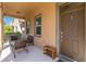 Inviting front porch with seating area and a view of the neighborhood at 12255 Joshua Tree Trl, Windermere, FL 34786