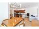 The kitchen and dining room combo with stainless steel appliances, ample counter space, and stylish lighting at 12255 Joshua Tree Trl, Windermere, FL 34786