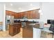 Modern kitchen features stainless steel appliances, granite countertops, island, and ample cabinet space at 12255 Joshua Tree Trl, Windermere, FL 34786