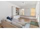 A cozy living room with built-in shelving, bench seating and natural light from the window at 12255 Joshua Tree Trl, Windermere, FL 34786