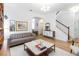 The spacious living room features hardwood floors, white walls, and an open floor plan at 12255 Joshua Tree Trl, Windermere, FL 34786