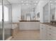 A luxurious bathroom with a soaking tub, a glass-enclosed shower, and ample counter space with storage at 12884 Penshurst Ln, Windermere, FL 34786