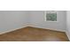 Bright bedroom with hardwood flooring, natural light from the window and neutral walls at 12884 Penshurst Ln, Windermere, FL 34786
