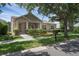 Charming single-story home featuring stone accents, well-maintained landscaping, and a welcoming front porch at 12884 Penshurst Ln, Windermere, FL 34786