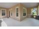 Spacious front porch with covered area and good natural light at 12884 Penshurst Ln, Windermere, FL 34786