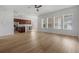 Open-concept living area features hardwood flooring, lots of light, and a seamless transition to the kitchen at 12884 Penshurst Ln, Windermere, FL 34786