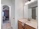 Bathroom with white cabinets, tile floor, and modern fixtures at 13025 Lake Roper Ct, Windermere, FL 34786