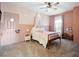 Pink bedroom with a twin bed, a canopy, and a ceiling fan at 13025 Lake Roper Ct, Windermere, FL 34786