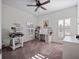 Bright room features two windows, a ceiling fan, and neutral carpet at 13025 Lake Roper Ct, Windermere, FL 34786