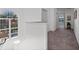 Upstairs hallway with neutral carpet, white walls, and a large arched window at 13025 Lake Roper Ct, Windermere, FL 34786