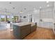 Open concept kitchen and living space with hardwood floors and modern appliances at 13025 Lake Roper Ct, Windermere, FL 34786