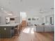 Open concept living space with hardwood floors, stairs, and lots of natural light at 13025 Lake Roper Ct, Windermere, FL 34786