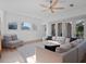 Bright living room with plenty of natural light and comfortable seating at 13025 Lake Roper Ct, Windermere, FL 34786