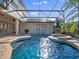 Inviting screened pool and spa, surrounded by well-manicured landscaping and lush greenery at 13025 Lake Roper Ct, Windermere, FL 34786