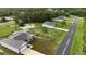 Aerial view of multiple single story homes along a quiet road at 1304 Hillsborough Ct, Kissimmee, FL 34759