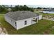 A charming single-story home featuring a gray roof, light gray siding, and a freshly-cut lawn at 1304 Hillsborough Ct, Kissimmee, FL 34759