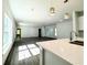 An open floor plan with modern lighting and hard flooring creates a spacious living area at 1304 Hillsborough Ct, Kissimmee, FL 34759