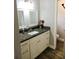 Stylish bathroom with granite countertop and double mirrors at 1361 Sterling Oaks Dr, Casselberry, FL 32707