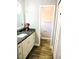 Well-lit bathroom with granite countertop and a view of the toilet and closet at 1361 Sterling Oaks Dr, Casselberry, FL 32707
