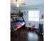 bedroom features wood floors, bunk beds, and a playful cartoon theme at 1361 Sterling Oaks Dr, Casselberry, FL 32707