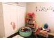 Spacious bedroom features wood floors, a dollhouse and cartoon wall decor at 1361 Sterling Oaks Dr, Casselberry, FL 32707