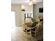 Bright dining room with wood-look tile floor has a wooden dining table that seats eight at 1361 Sterling Oaks Dr, Casselberry, FL 32707