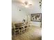 Bright dining room features a ceiling fan, wood-look tile floor, and a wooden dining table that seats eight at 1361 Sterling Oaks Dr, Casselberry, FL 32707