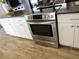 A stainless steel stove and white cabinets add elegance to this modern kitchen at 1361 Sterling Oaks Dr, Casselberry, FL 32707