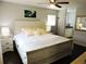 Spacious main bedroom featuring a ceiling fan, ensuite bath and neutral color palette at 1361 Sterling Oaks Dr, Casselberry, FL 32707